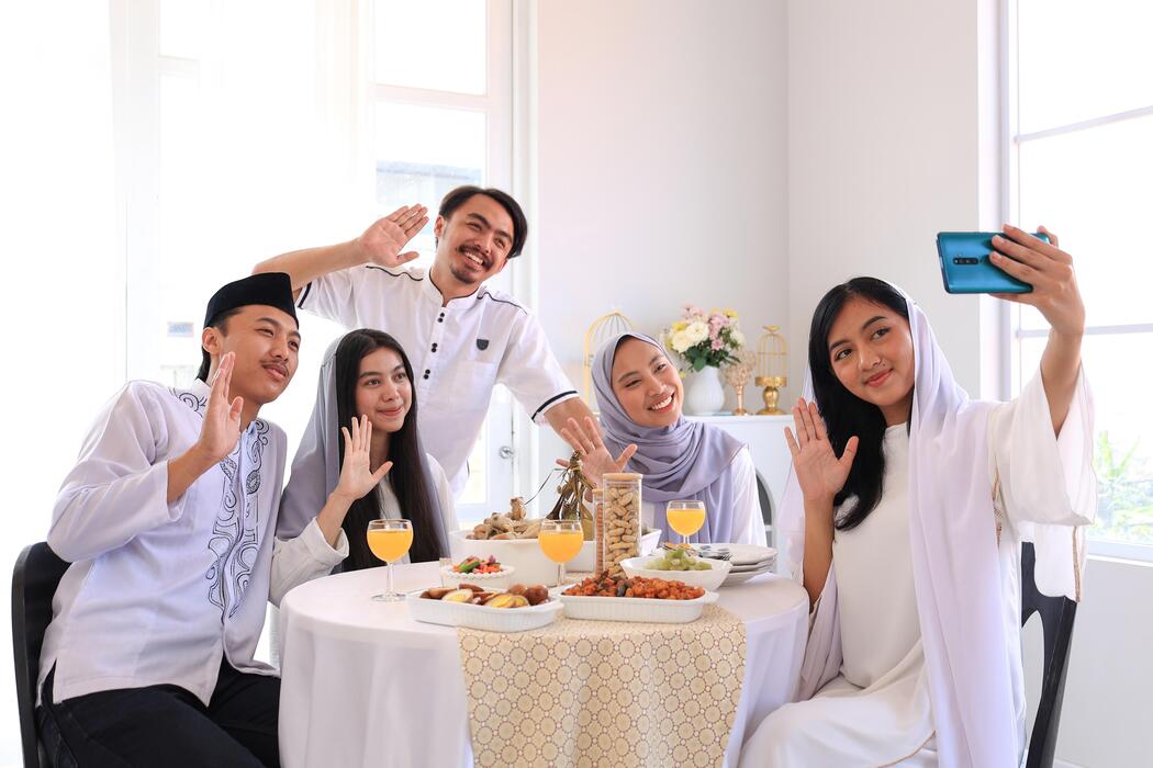 a-group-of-friends-taking-selfie-during-eid-al-fitr-celebration-photo